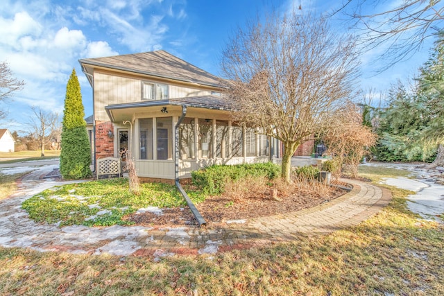 view of front of property with a sunroom