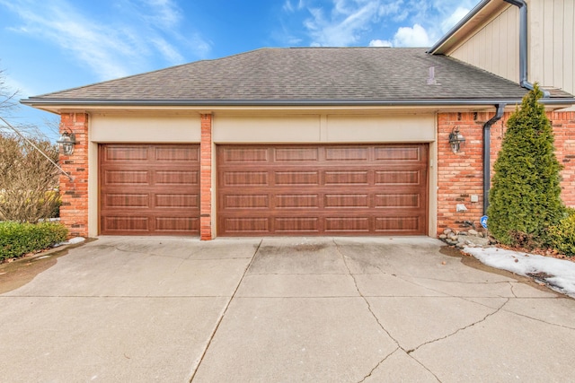 garage with concrete driveway