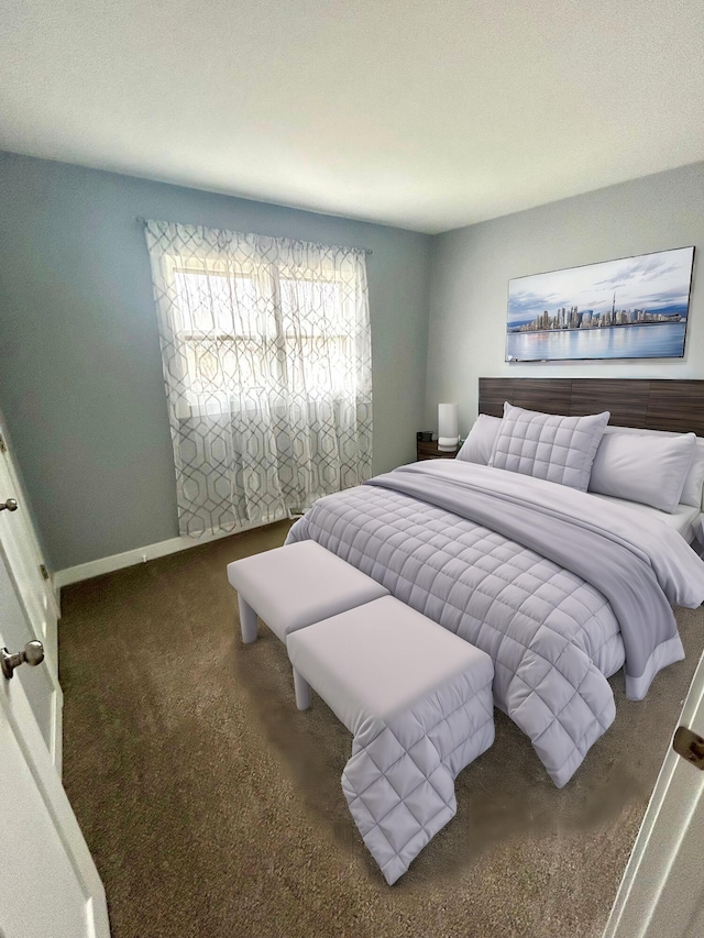 bedroom featuring carpet and baseboards