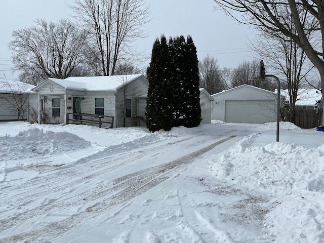 view of front facade with a garage and an outdoor structure