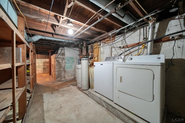 unfinished basement with washing machine and dryer