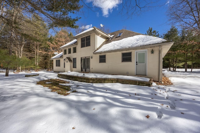 view of snow covered house