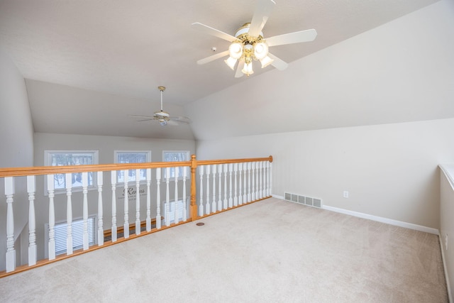 bonus room with baseboards, visible vents, a ceiling fan, lofted ceiling, and carpet flooring