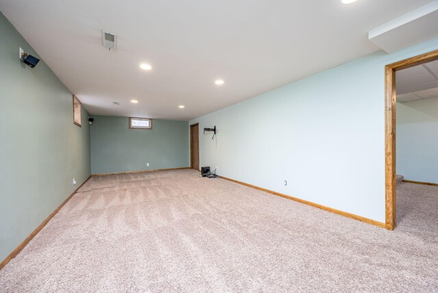 finished basement with carpet floors, recessed lighting, visible vents, and baseboards