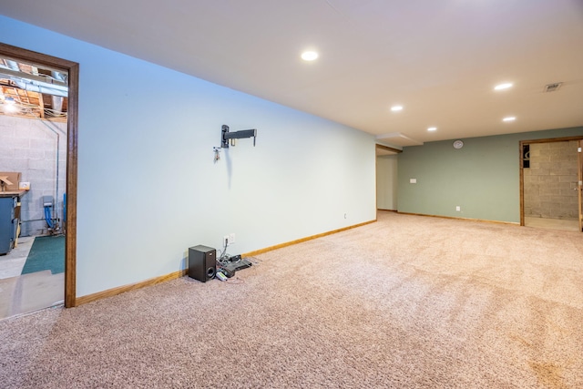 finished basement with light carpet, baseboards, and recessed lighting