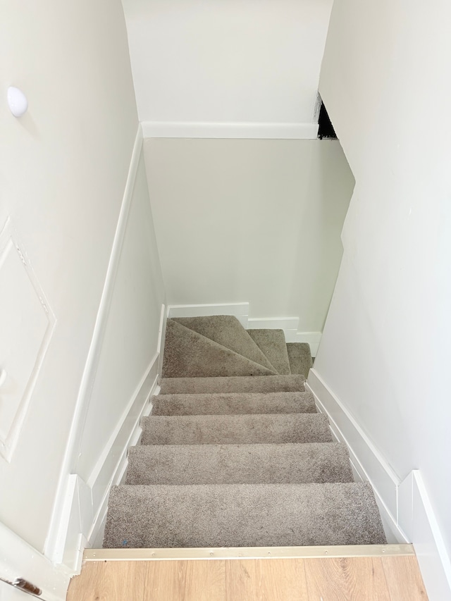 stairs featuring baseboards