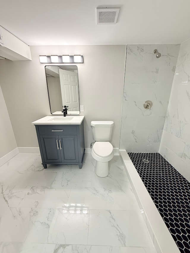 bathroom featuring marble finish floor, a marble finish shower, visible vents, toilet, and baseboards