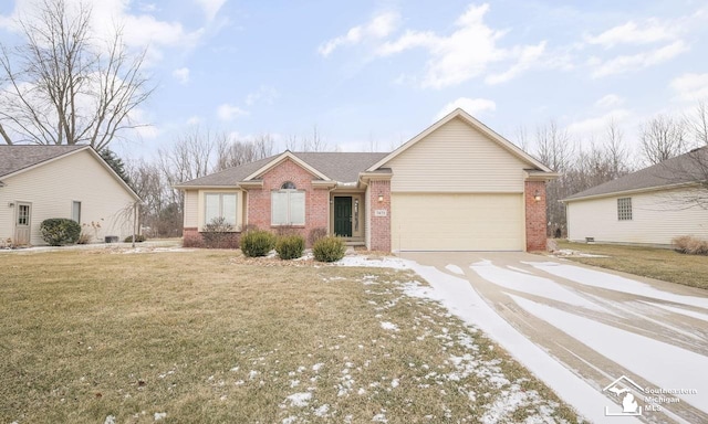 ranch-style home featuring driveway, brick siding, a front lawn, and an attached garage