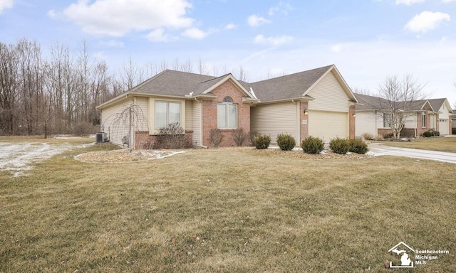 ranch-style house featuring a front yard, concrete driveway, brick siding, and an attached garage