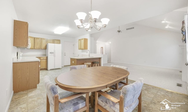 dining area with lofted ceiling, visible vents, light carpet, baseboards, and ceiling fan with notable chandelier