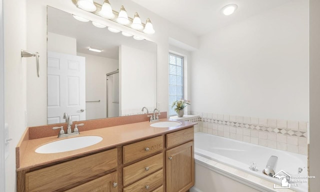 full bath with a garden tub, double vanity, a sink, and a shower with door