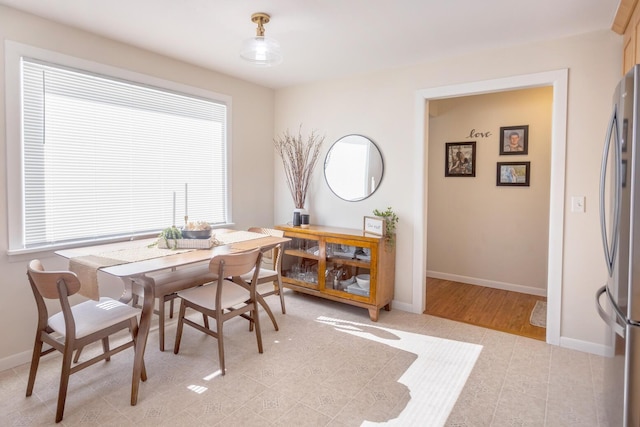 dining room featuring baseboards