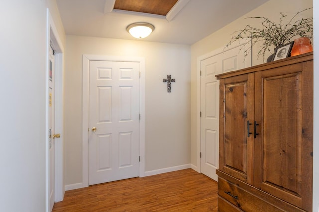 entrance foyer with light wood finished floors and baseboards