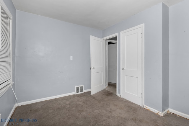 unfurnished bedroom with visible vents, a closet, baseboards, and carpet flooring