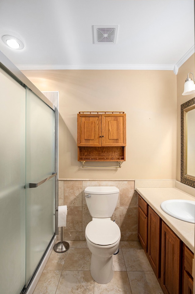 bathroom with a stall shower, visible vents, and tile walls