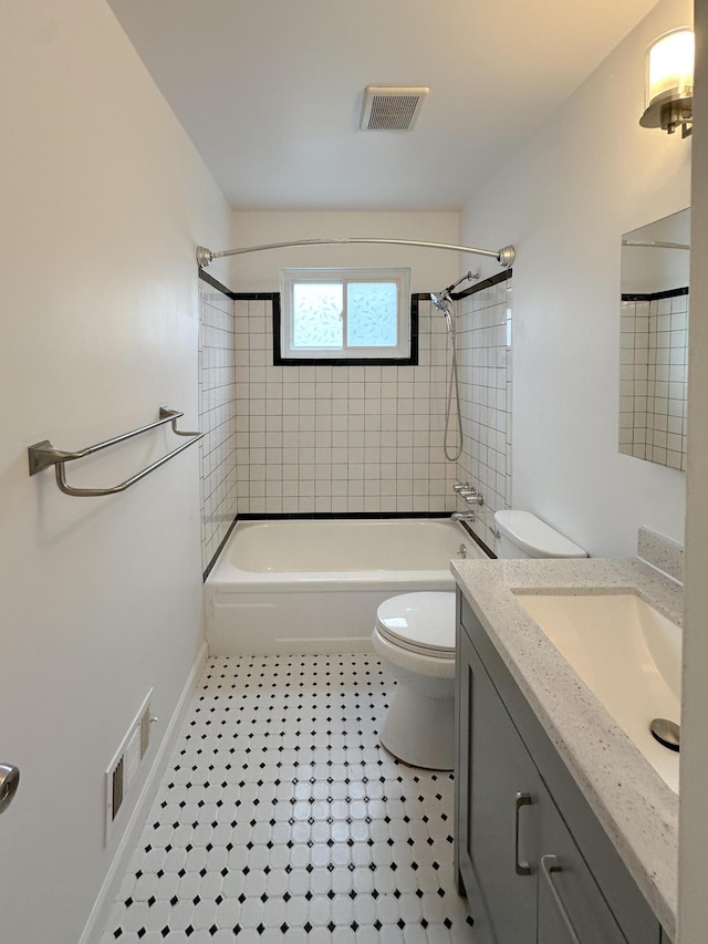 bathroom featuring visible vents, shower / tub combination, vanity, and toilet