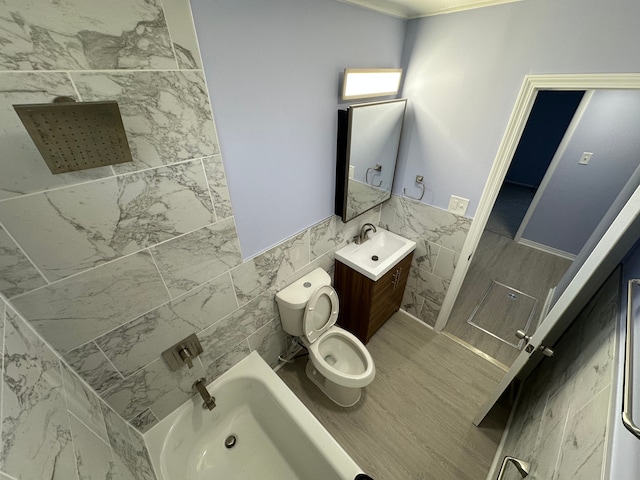 full bathroom with toilet, vanity, walk in shower, and tile walls