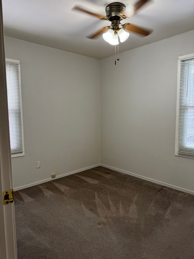 unfurnished room with carpet floors, ceiling fan, and baseboards