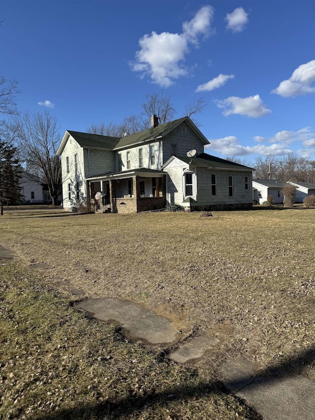 view of property exterior featuring a yard and a chimney