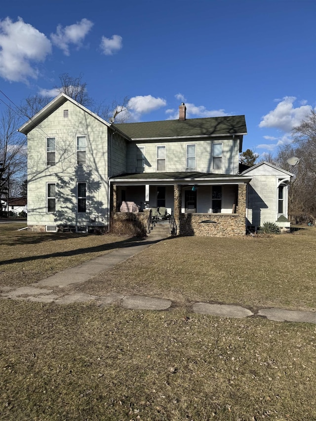 view of front of house with covered porch and a chimney