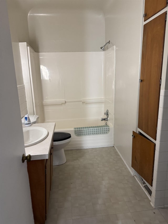 full bathroom with  shower combination, toilet, and vanity