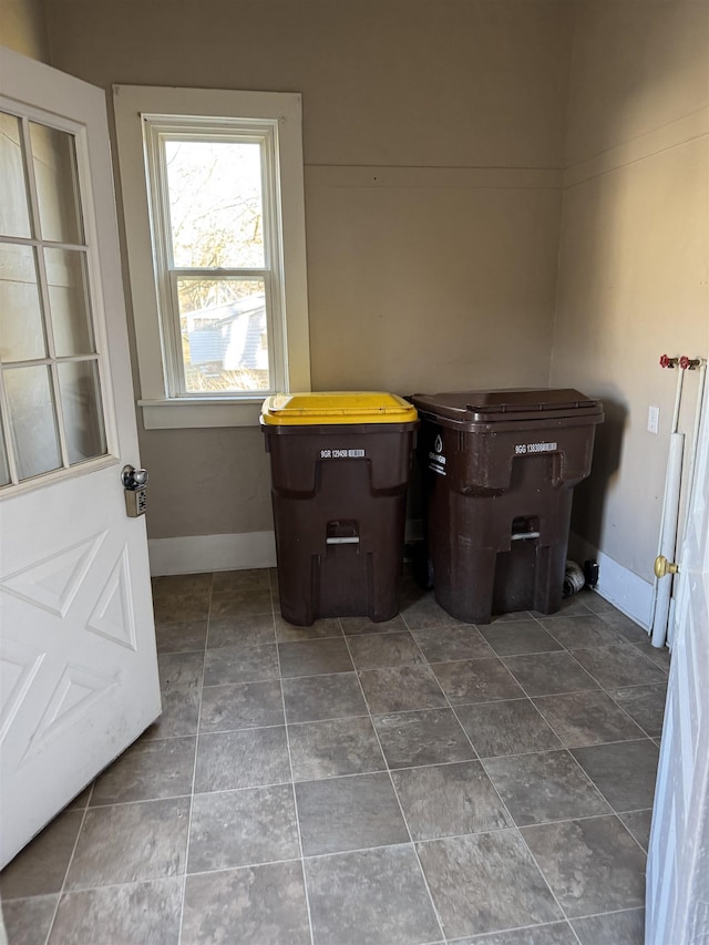 interior space featuring baseboards