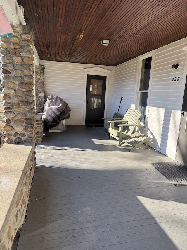 entrance to property featuring covered porch