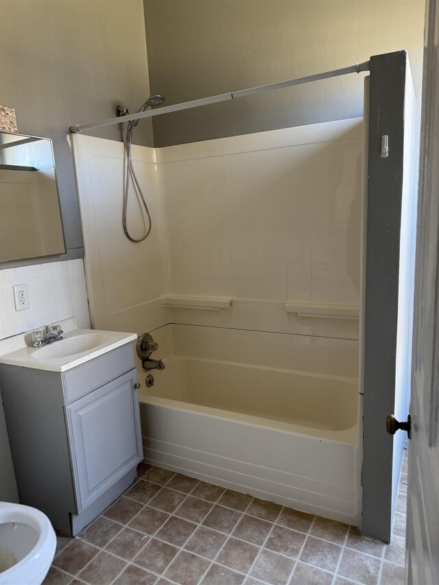 full bathroom with shower / tub combination, vanity, and tile patterned floors