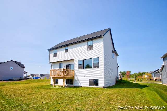 back of property featuring a lawn