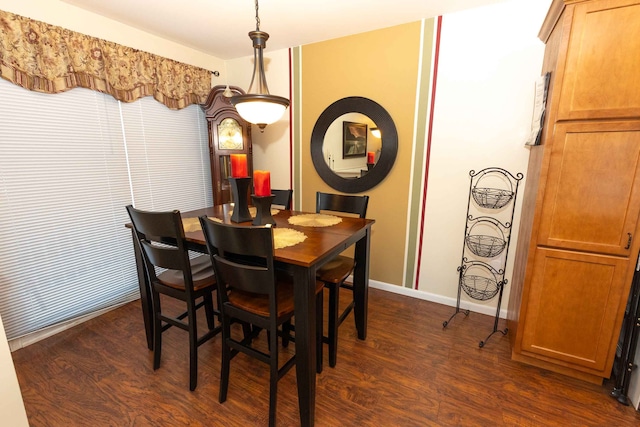 dining space with dark wood-style floors and baseboards