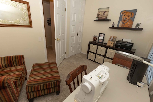 living area featuring carpet and baseboards