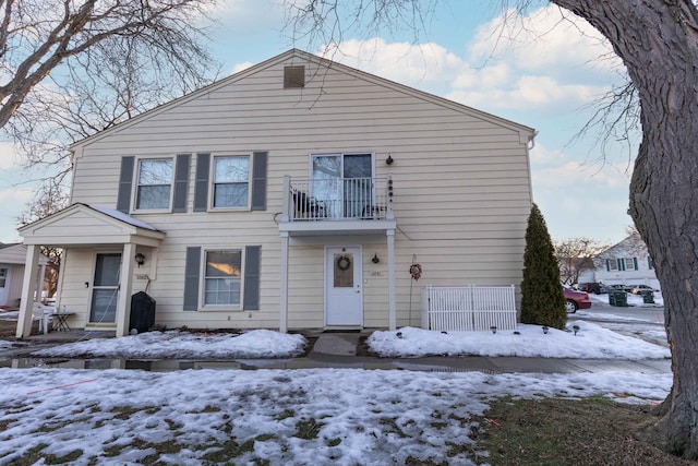 view of front of home featuring a balcony