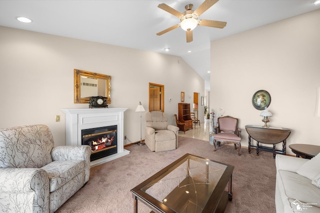 carpeted living area featuring lofted ceiling, ceiling fan, a glass covered fireplace, and recessed lighting