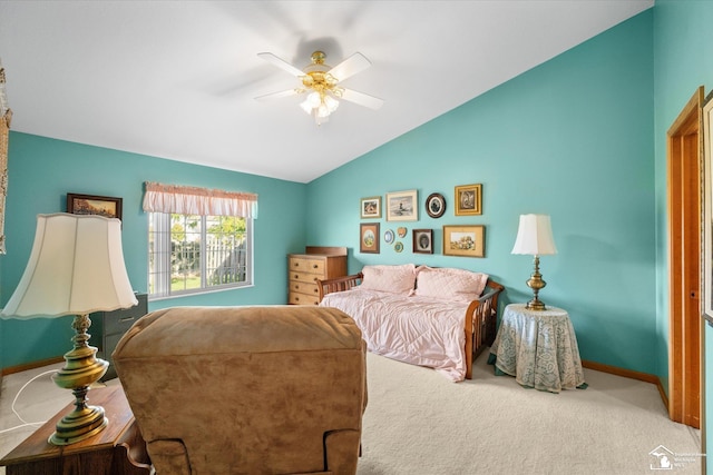 bedroom with carpet floors, ceiling fan, baseboards, and vaulted ceiling