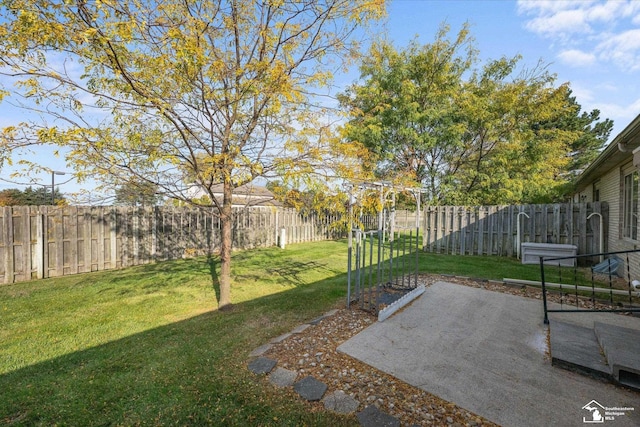 view of yard featuring a patio area and a fenced backyard