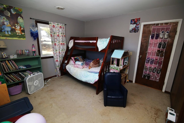 carpeted bedroom featuring baseboards