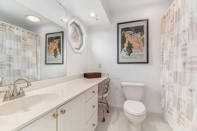 bathroom with recessed lighting, toilet, vanity, tile patterned flooring, and baseboards