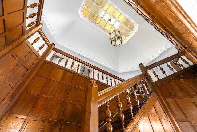 staircase featuring a high ceiling