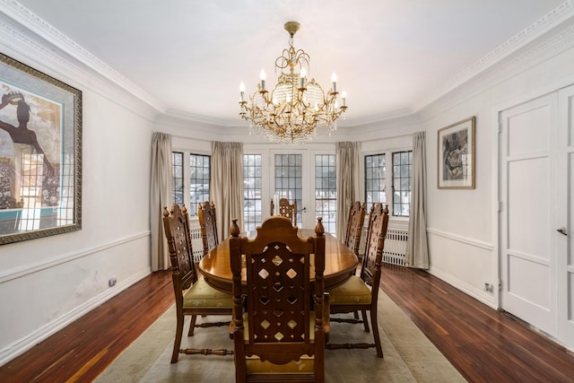 dining space with french doors, ornamental molding, wood finished floors, a chandelier, and baseboards