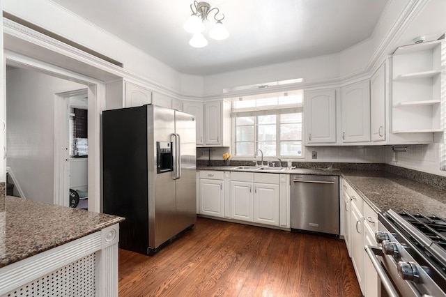 kitchen with white cabinetry, stainless steel appliances, and a sink