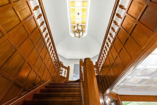 stairs with coffered ceiling and crown molding