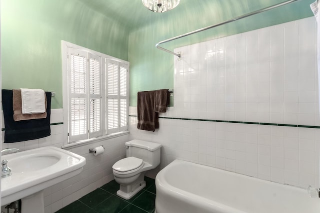 full bathroom featuring tile walls, toilet, a bath, walk in shower, and tile patterned floors