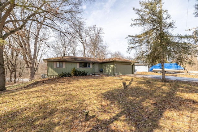 view of front of home with a garage and a front yard