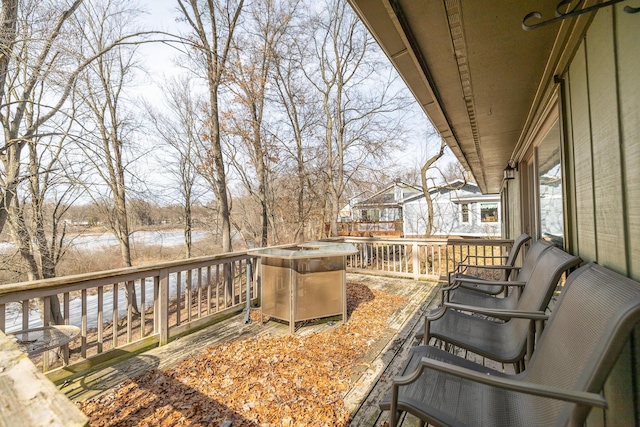 wooden deck with a water view