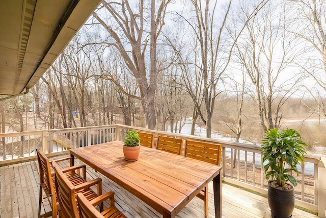 wooden terrace featuring outdoor dining space