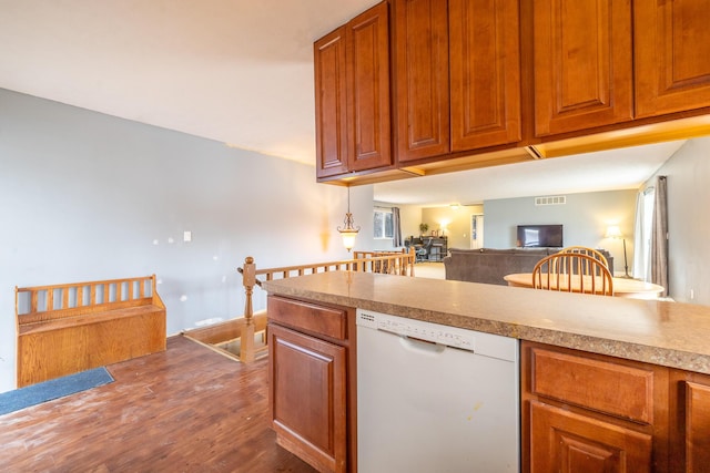 kitchen with visible vents, brown cabinetry, dark wood finished floors, dishwasher, and open floor plan