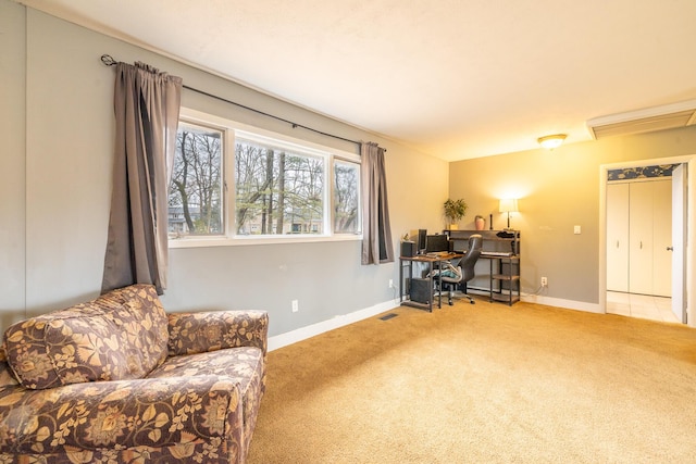 carpeted office with visible vents and baseboards