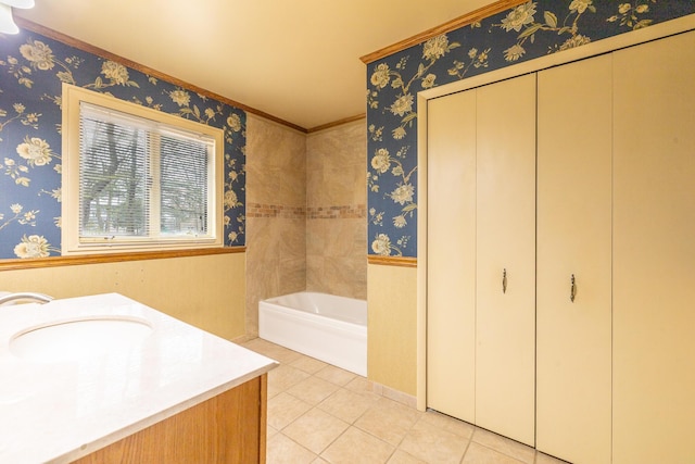 full bath with vanity, tile patterned flooring, a bath, and wallpapered walls