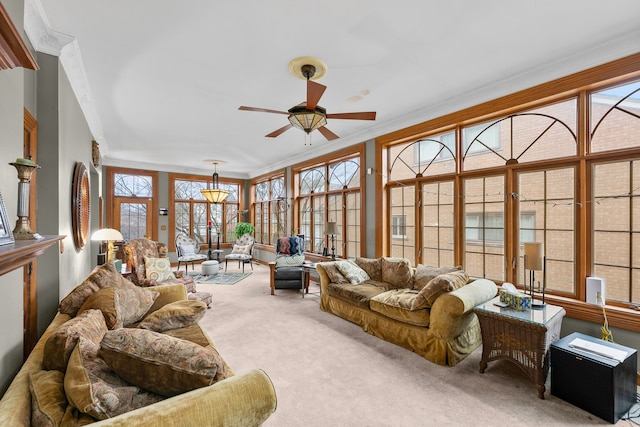 sunroom / solarium featuring ceiling fan