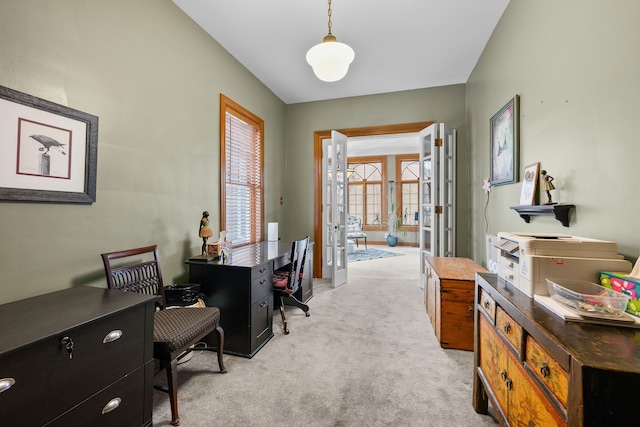 office with french doors and light colored carpet